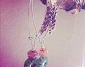 wire wrapped with smoky quartz with dangling fire pressed green bead and fire polished fuchsia czech glass bead