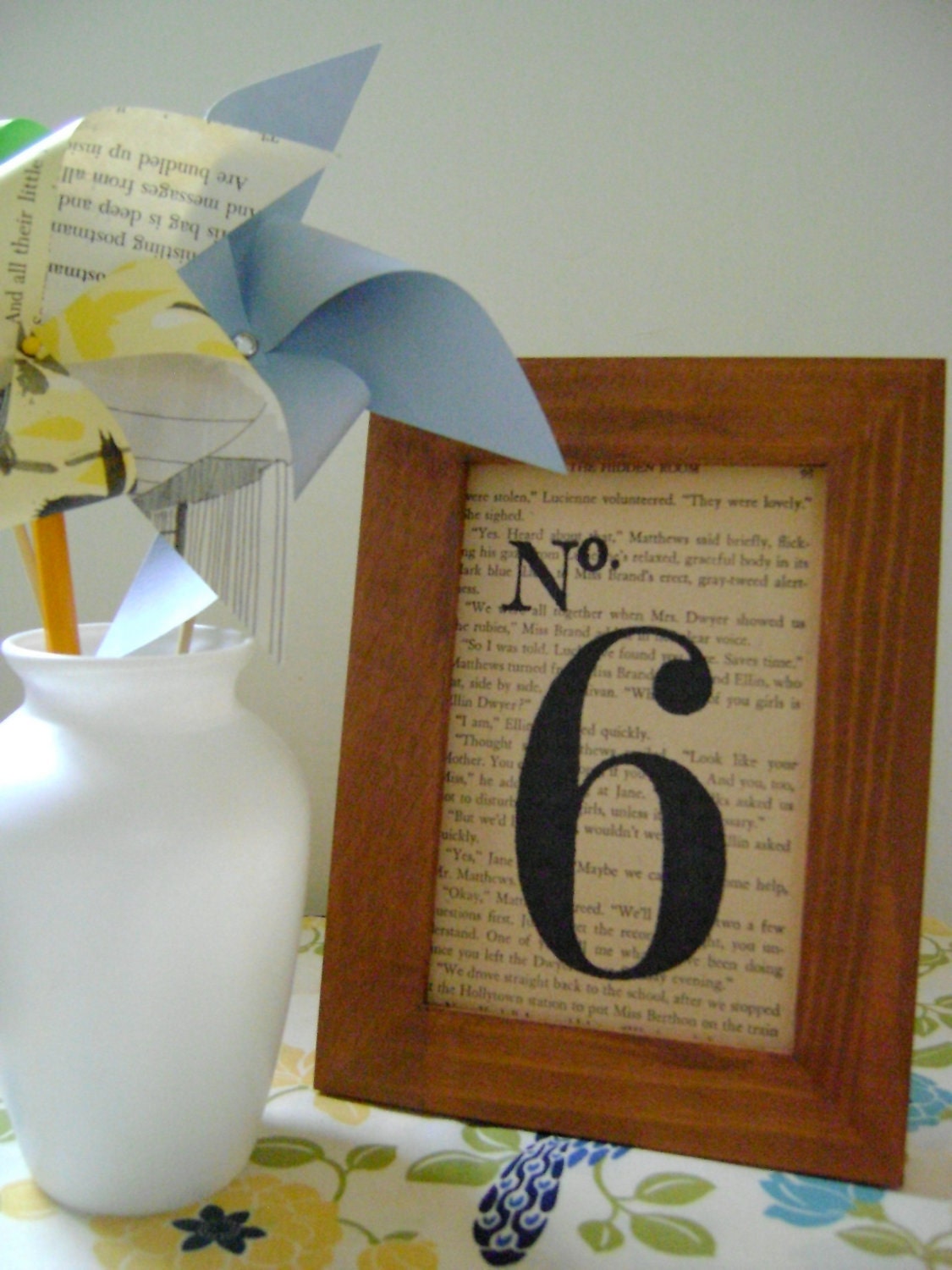 Wedding table numbers / black stenciled number on book page / in stained wood frame / wedding décor