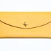 Mustard Yellow Leather wallet with golden pyramid