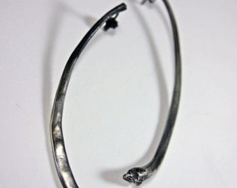 forget me not. snake rib earrings.