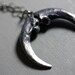 naja. owl talon crescent.