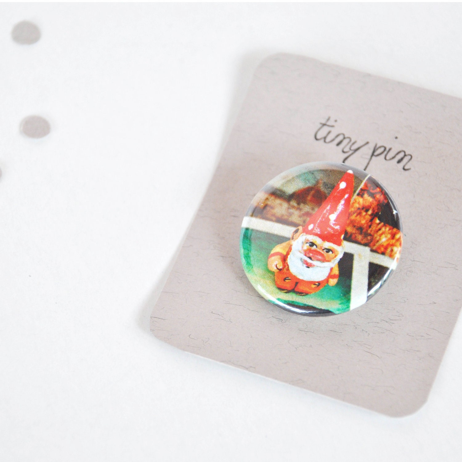 Dwarf pin illustrated button brooch