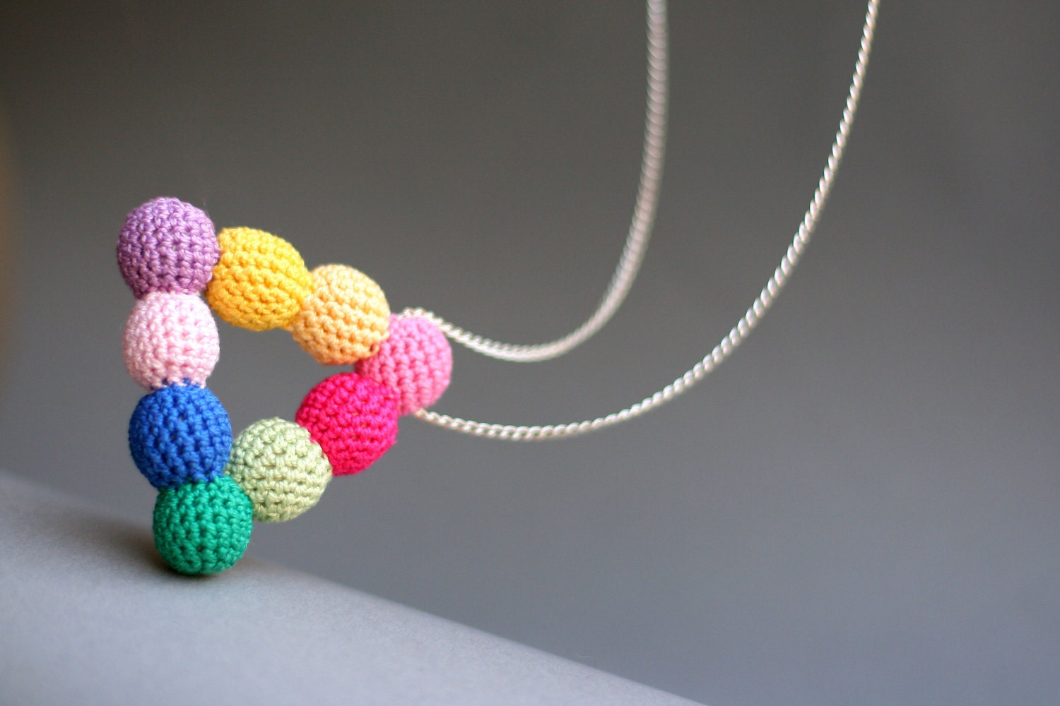crochet spring triangle necklace, handmade from pastel, bright pink, blue, yellow beads with long metal chain, boho style, gift for her