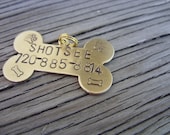 Hand stamped brass dog tag bone  with name and phone number 19x32mm - beadsoul