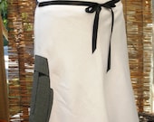 Mod Moai Madness A-line linen skirt, with swirly hem detail