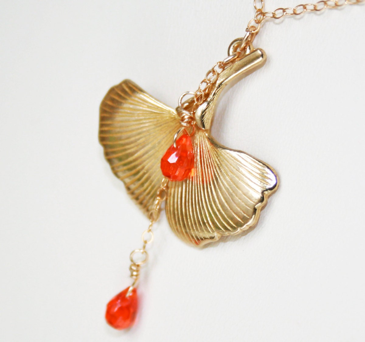 Gold Ginkgo Leaf Pendant with a delicate polished brass charm, hyacinth cubic zirconia drops and shimmery gold filled chain, timeless elegan