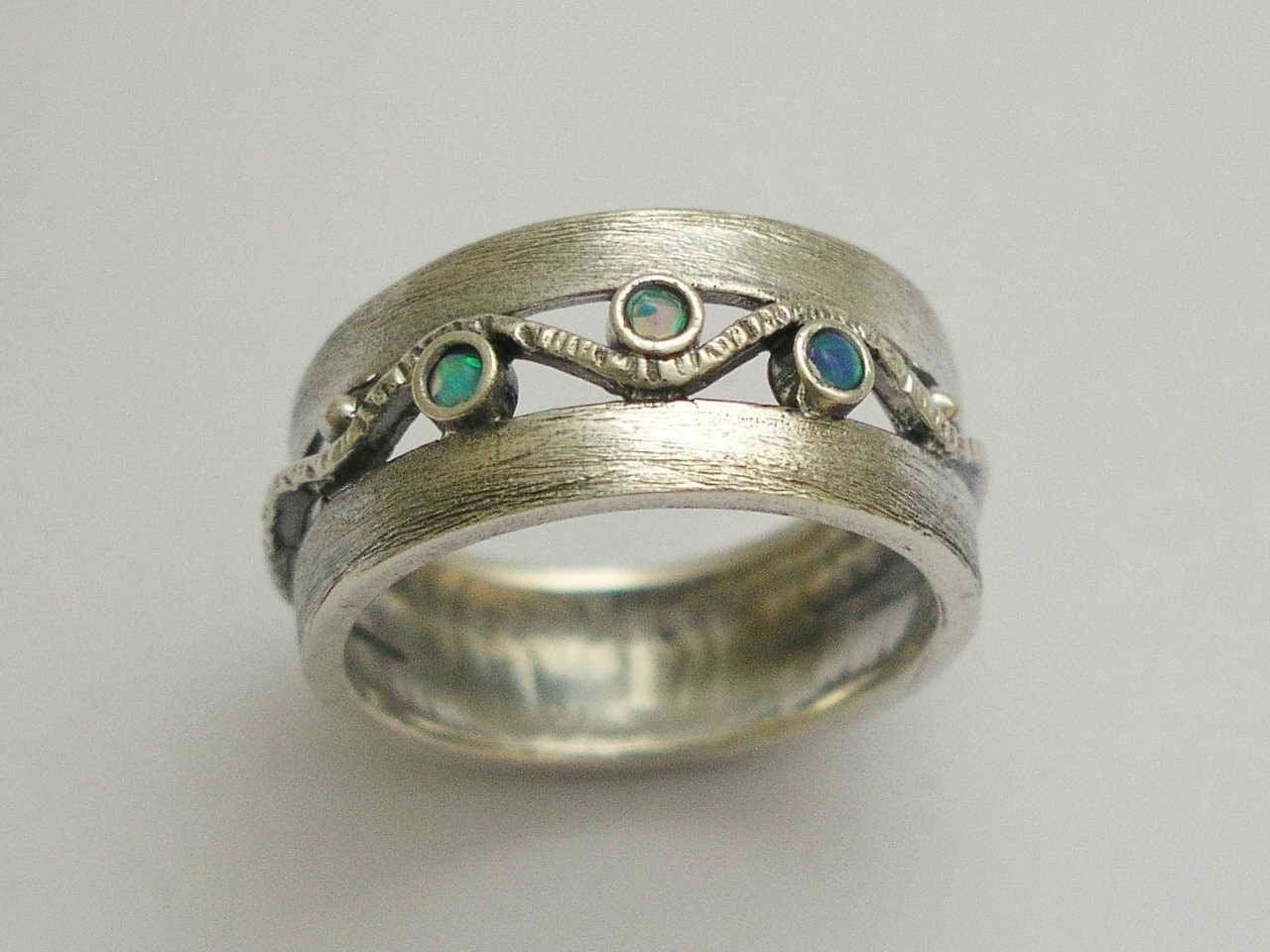 Brushed sterling silver ring with blue opal gemstones - Entertainment tonight .