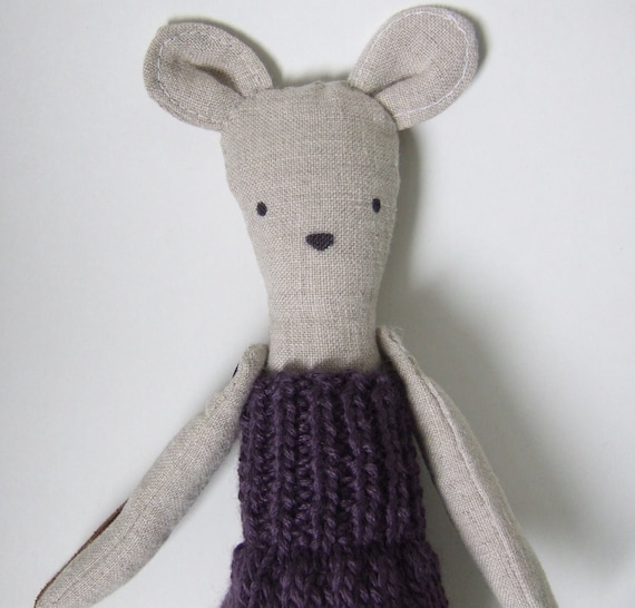 Penelope the linen mouse doll goes to school in her purple knit dress.
