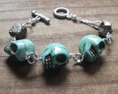skull bracelet, calavera beadwork bracelet, day of the dead bracelet, turquoise colored skull bracelet, wire wrapped skull bracelet