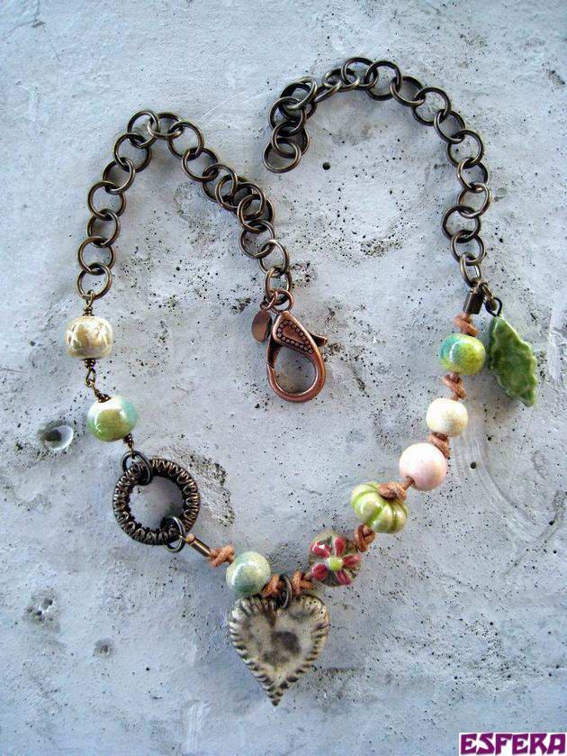 Green, boho necklace with porcelain beads from Gaea, vintage brass and leather cord by Esfera jewelry