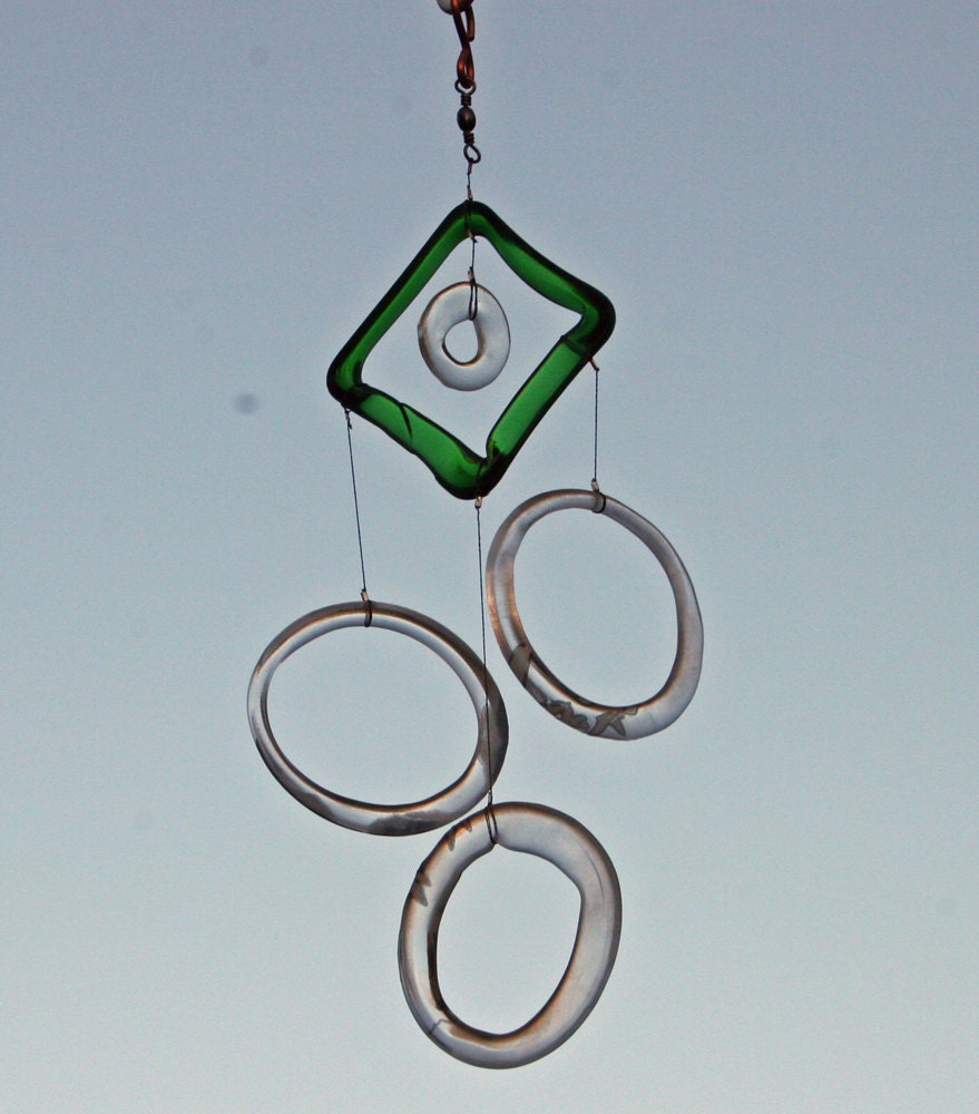 grey goose vodka rings repurposed into a wind chime with green glass