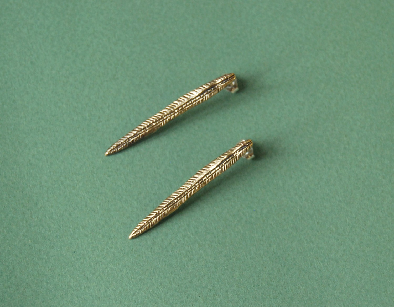 Golden spear earrings