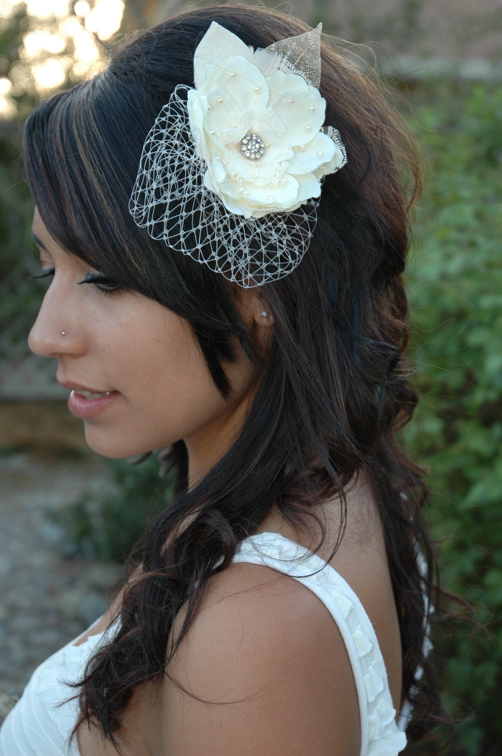 Beautiful bridal hairpiece with small birdcage veil