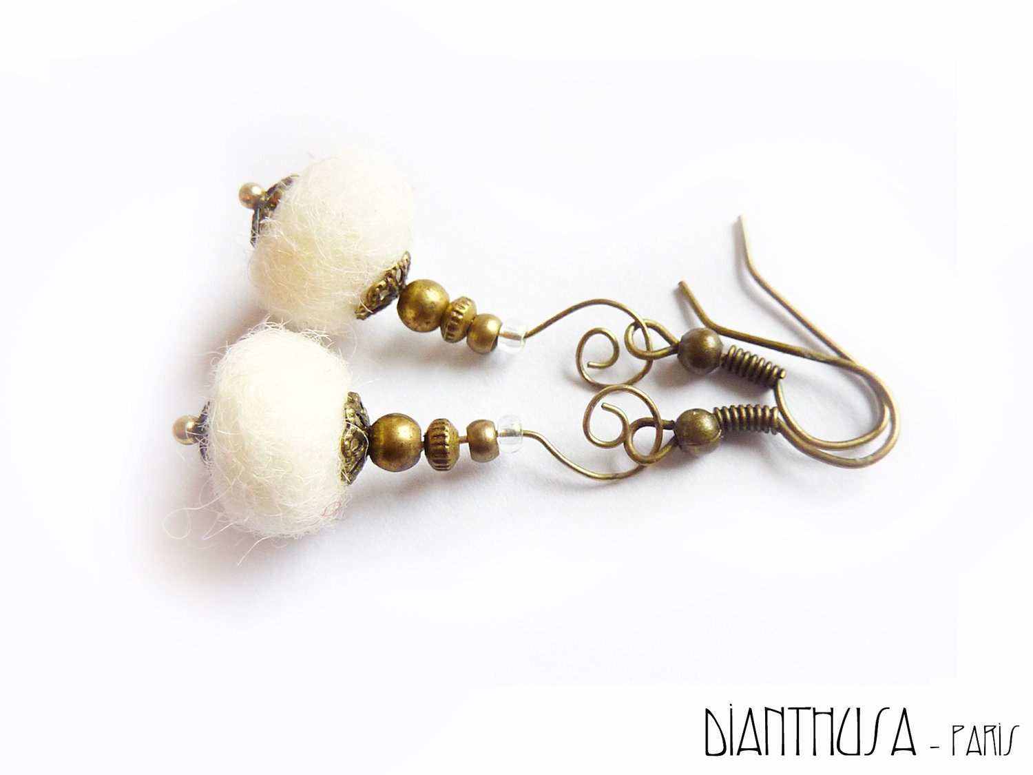 White dangle felted earrings.