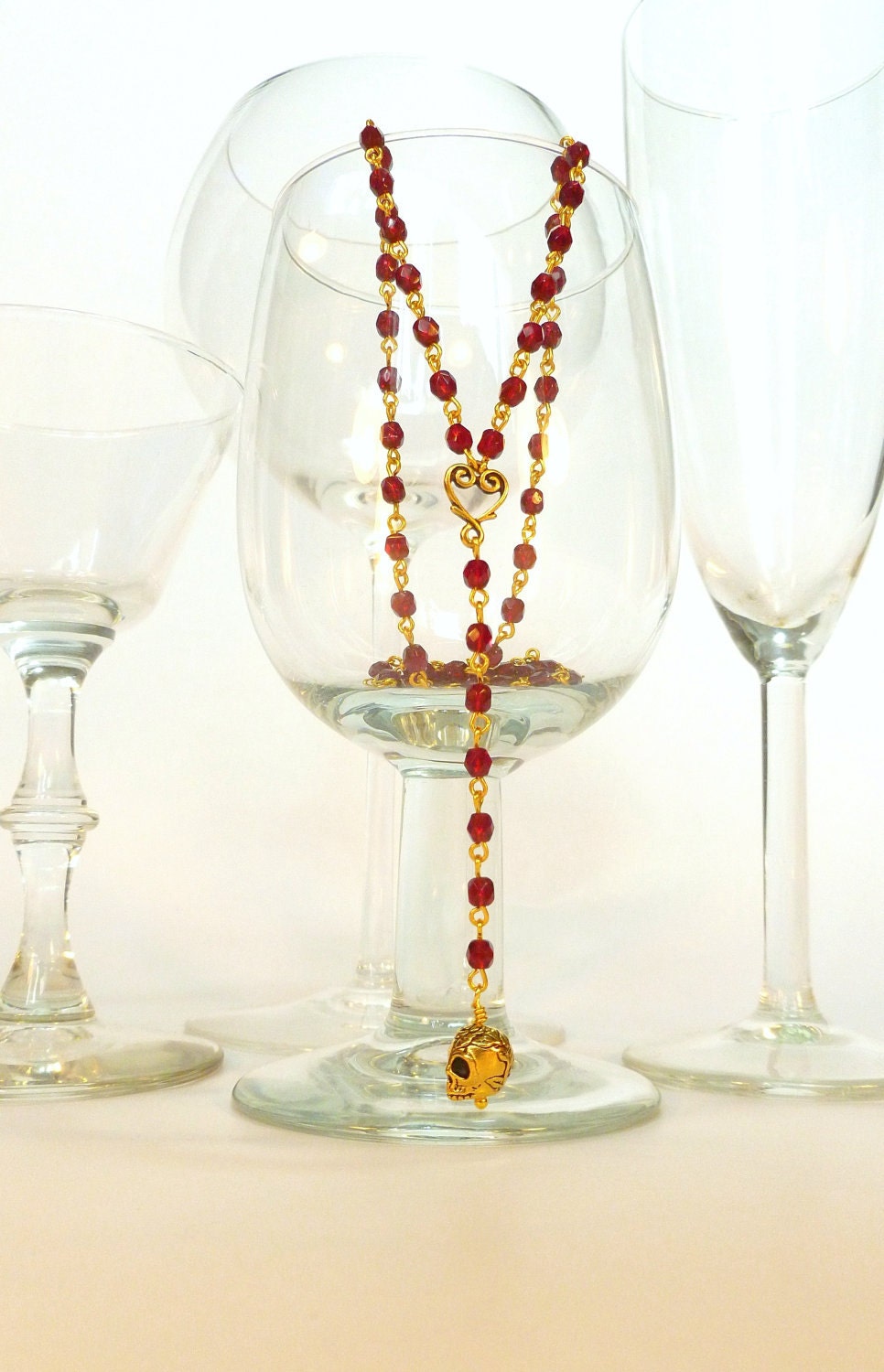 Garnet Red Crystal and Gold Heart and Skull Extra Long Rosary Style Necklace