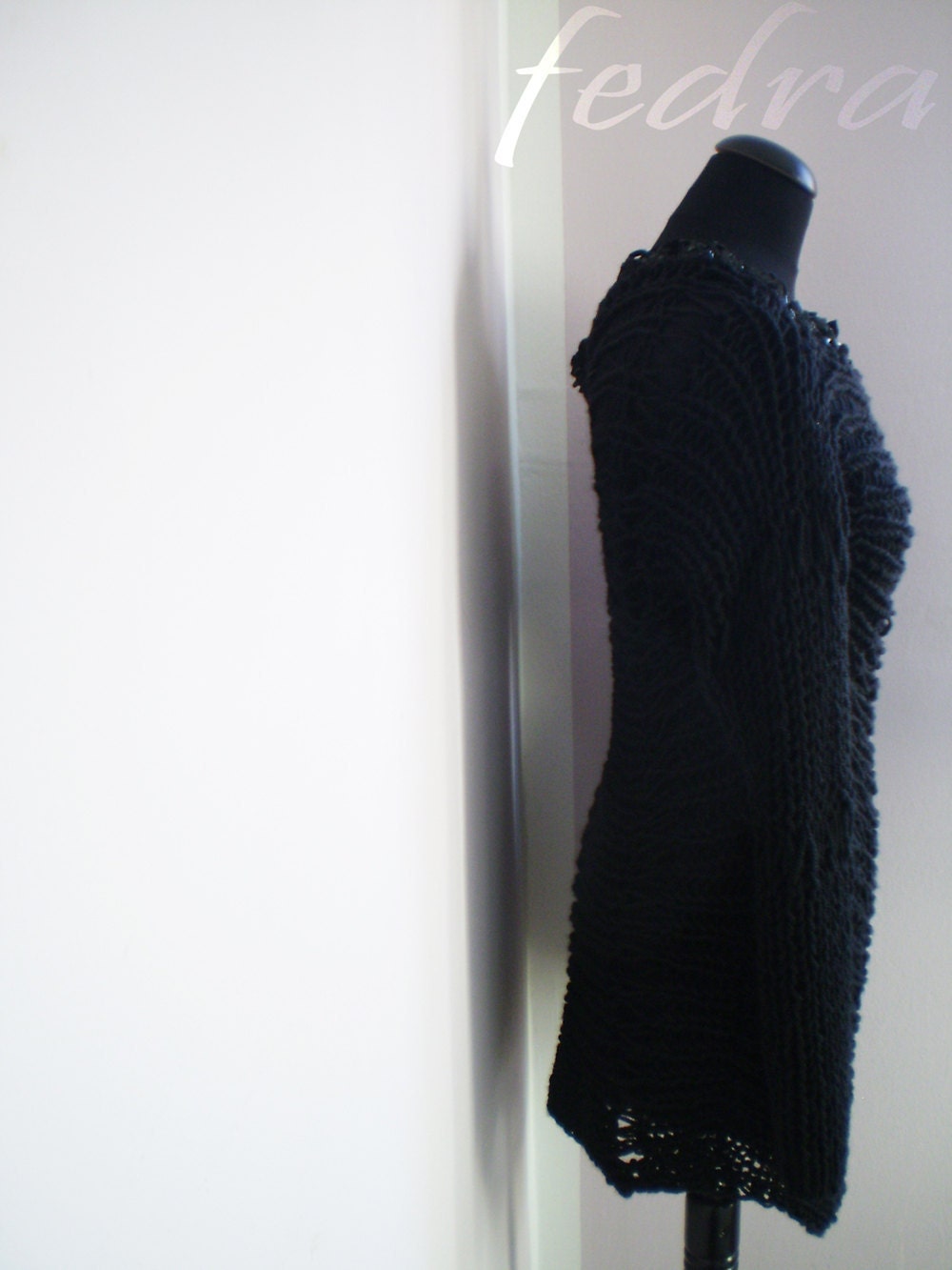 black loose unstructured sweater with braided leather collar