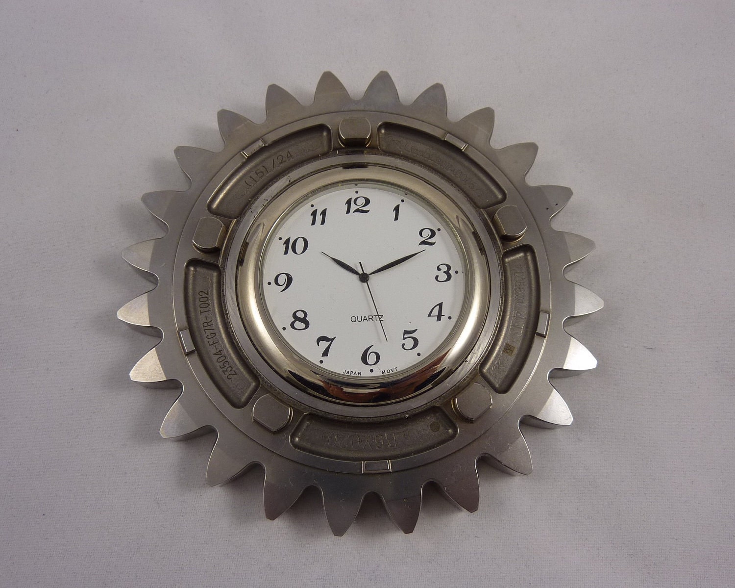 Unique steampunk style wall clock made from a Honda F1 racecar gear ratio