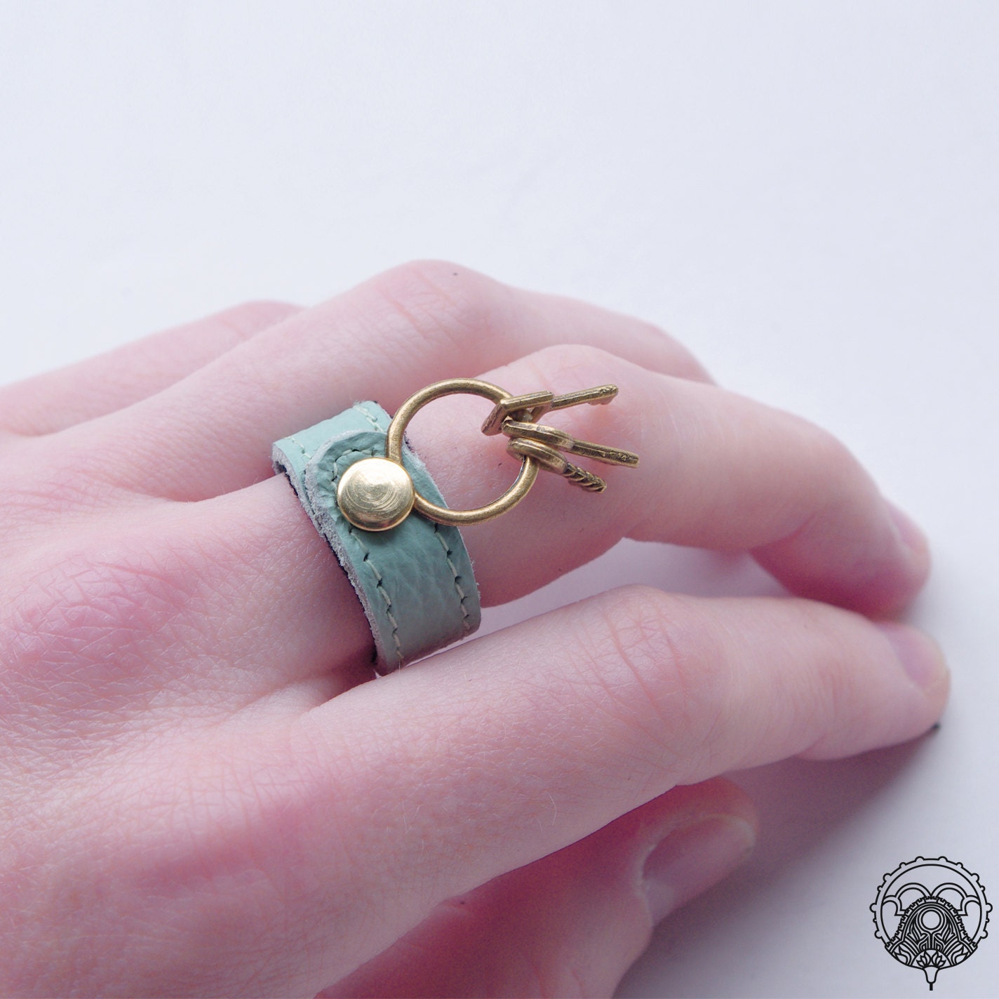 Lt. turquoise leather ring with key charm