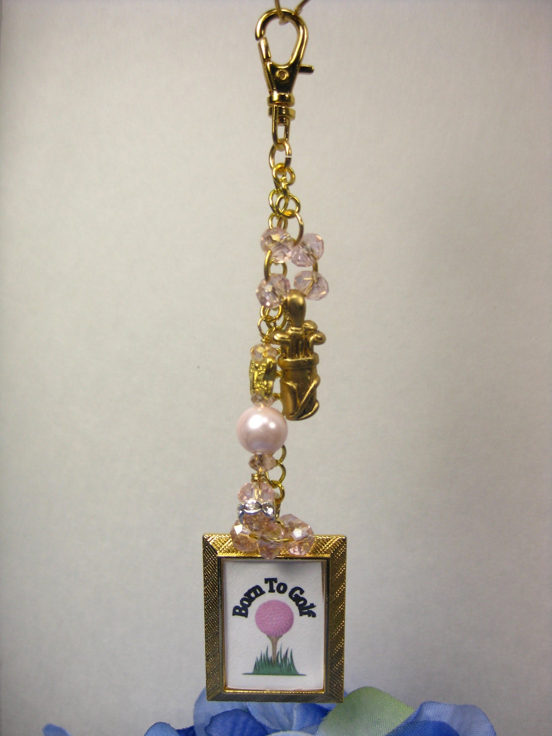 Born To Golf Charm Golf Bag Charm, crystals, pearls, butterfly, and a golf bag charm add that feminine touch to your golf bag or purse.