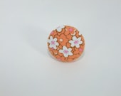 Orange white flowers pink ring adjustable tiny small black outline handmade round fabric covered button unique fun pretty