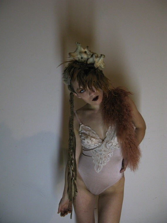 Cave girl cap. Leather fake fur, feathers and Vertebrae.