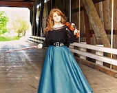 Stunning maxi skirt with dressy satin bands. Comes in peacock blue, black, olive green, silver, plum, latte.