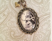 Alice's Adventures in Wonderland by Lewis Carroll Alice and the Flamingo Antiqued Bronze Book Page Literature Necklace