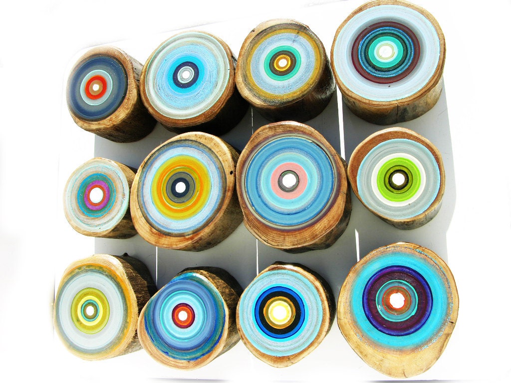 group of modern paintings shades of blues greens and yellows mixed with natural materials found in nature modern wall art for a chic house