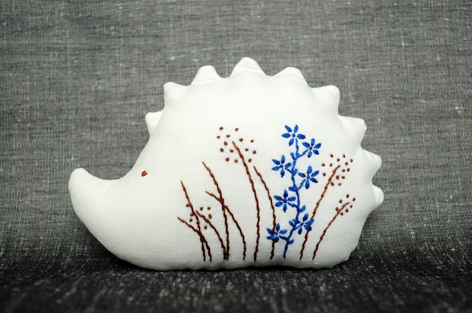 Tiny Happy Hedgehog with One Blue Flower