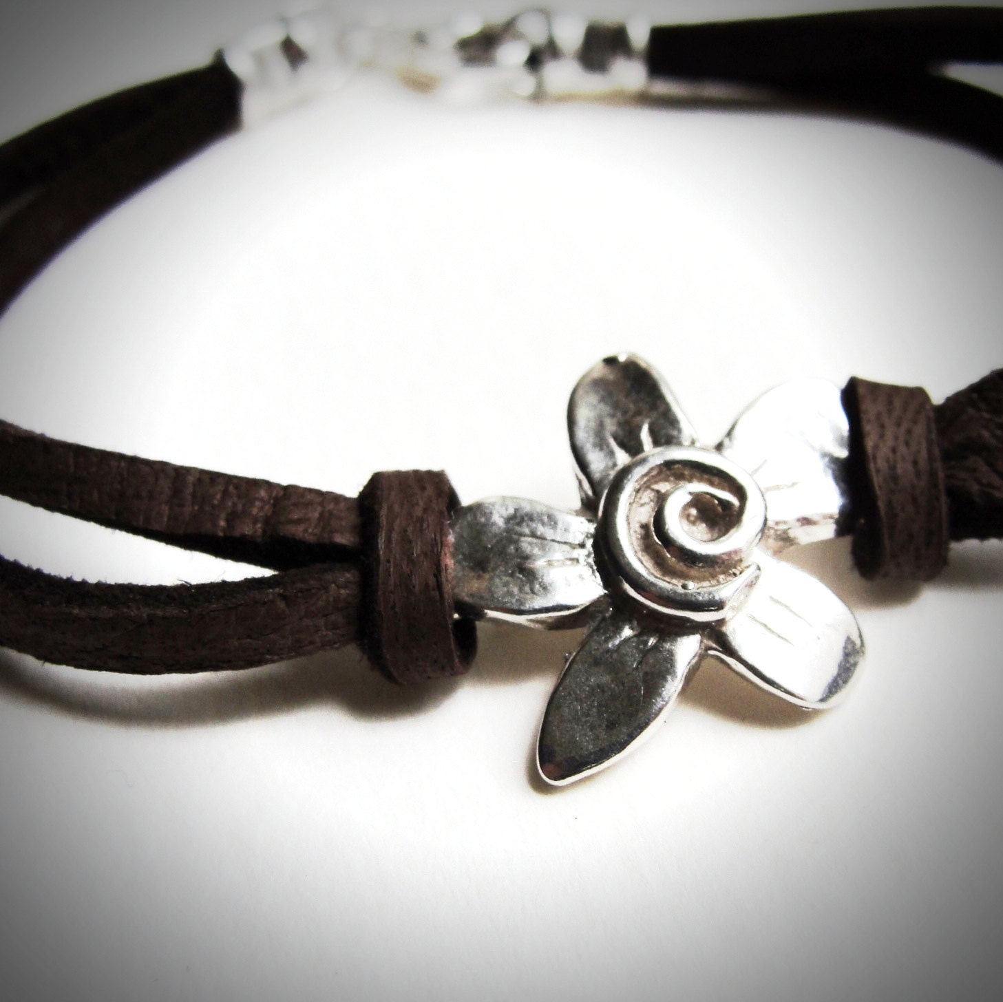 Sterling Spiral Fleur on Leather bracelet