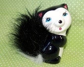 SALE Vintage Ceramic and Faux Fur Skunk Figurine.