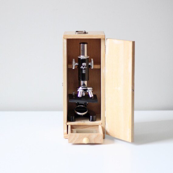vintage skyline black microscope with cabinet
