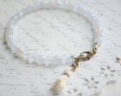 Lavender stone bracelet-- Czech lavender stone, antiqued brass clasp and soft tassel charm