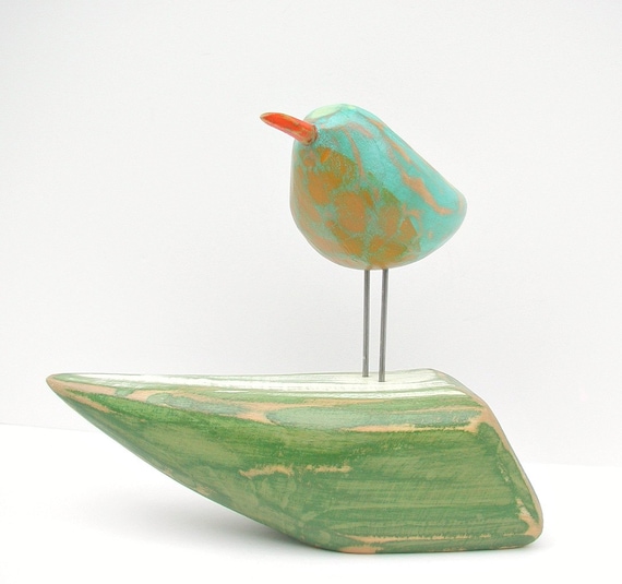 bird on boat woodcarving painted bird sculpture
