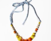 Color Pop Necklace in Citrus & Marbled Blue . Non-toxic Beads with a Jersey Tie . Fashionable and baby-friendly