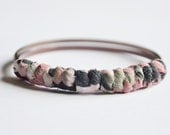 Fabric bangles. Hand wrapped blush and gray fabric knotted around two midnight mauve bangles. XS/Small Size.