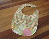 Reversible and Adjustible Bib with Pocket in Green, Orange, and Pink Floral and Stripes