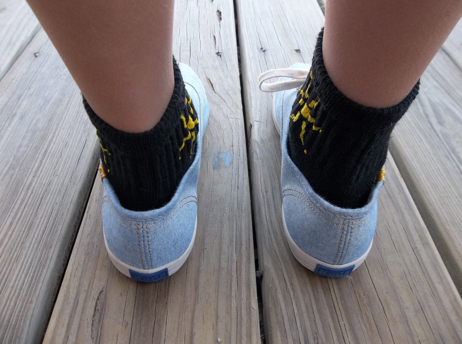 a "Summer Sunshine" - Hand Painted Black Socks for Bigger Feet: Simple Tribal Sun (kid large/xl - women's xs/small)
