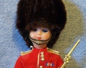 Vintage Female Beefeater London Guard, Fur Hat and Gold Rifle, Closing Eyes, British Souvenier, 1970s