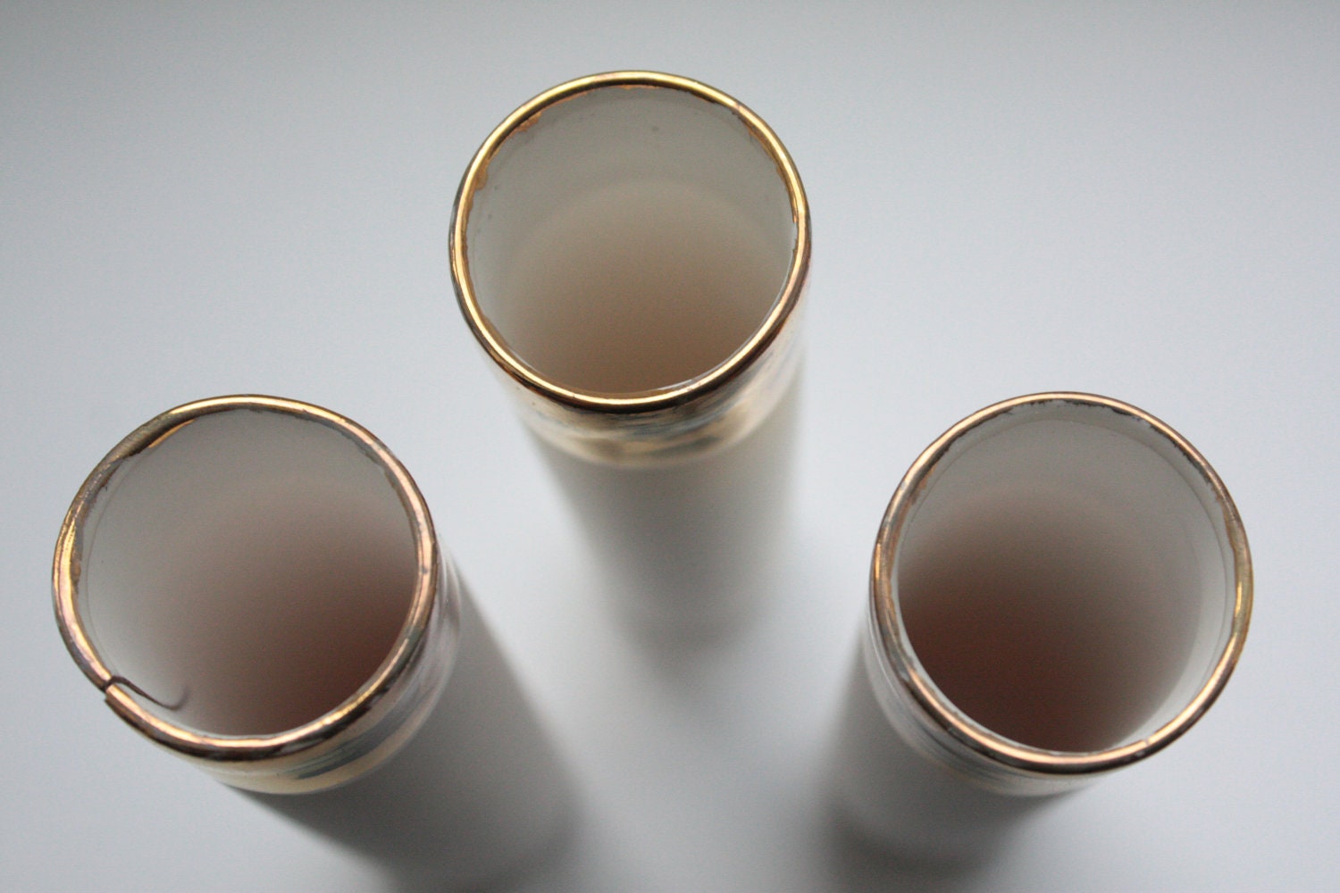 Decorative thin tall tubes made out of stoneware English fine bone china  with real gold.