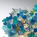Wall lamp. Blue shades of flowers and leaves.