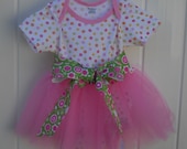 White onesie bodysuit with flower print and pink tulle tutu skirt