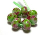 Handmade Lampwork Glass Beads in Greens and Pinks - Frangipani on Soft Green - set of 7