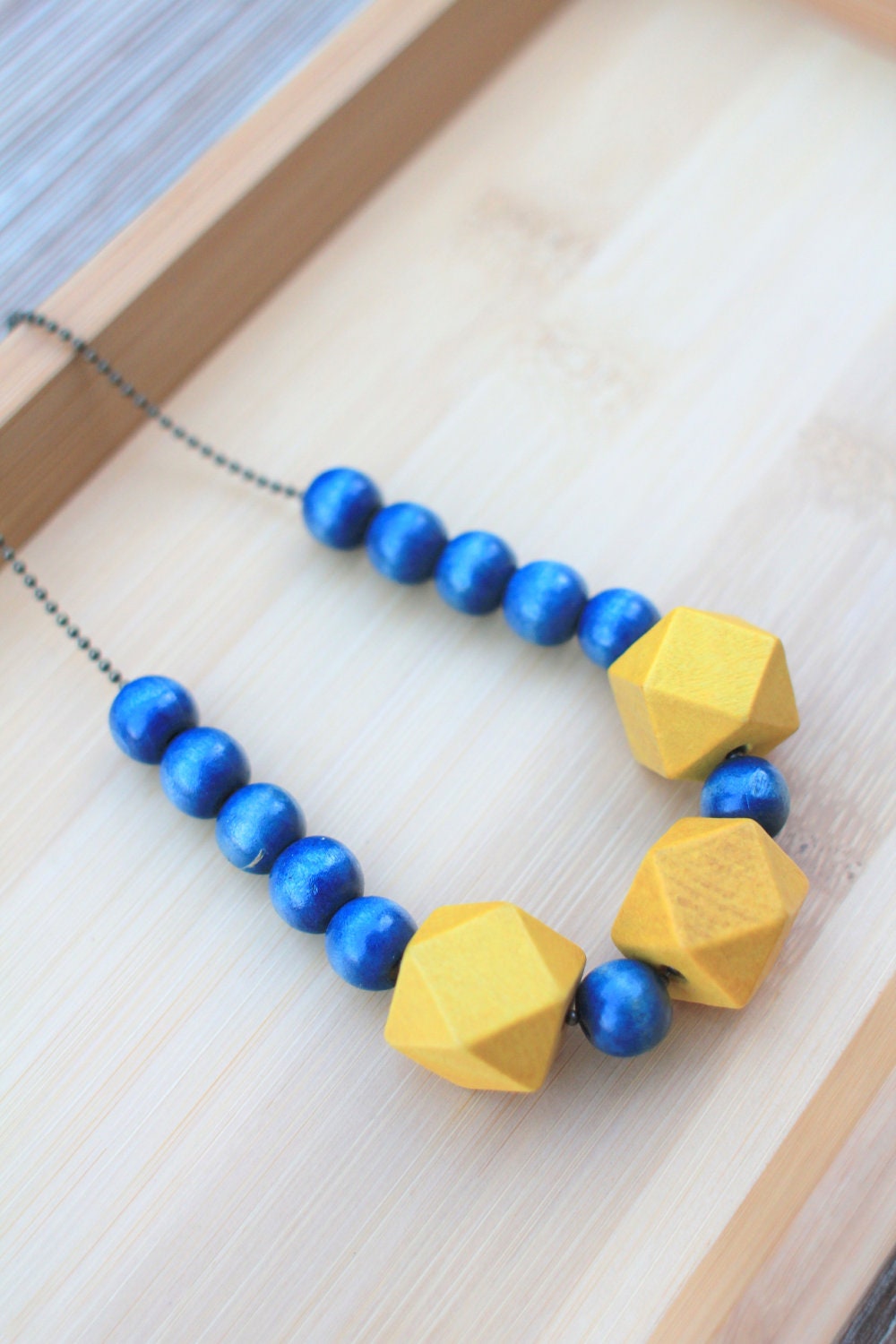 NECKLACE Geometric Wood Beads in Navy and Yellow strung on Antique Brass Ball Chain