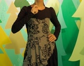 Little Black Dress.  long sleeved LBD with rose print accents.  sweetheart bodice, asymmetrical layers and draping, side pocket.