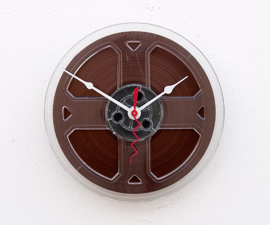 Recycled magnetic tape reel clock