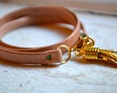 dusty pink shiny pastel leather triple wrap bracelet with gold tassel