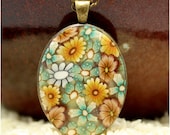 Polymer clay necklace, OOAK flowers in oval bezel, polymer clay millefiori flowers, little flowers, antiqued gold chain and bezel