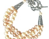 freshwater peach pearl three strand bracelet