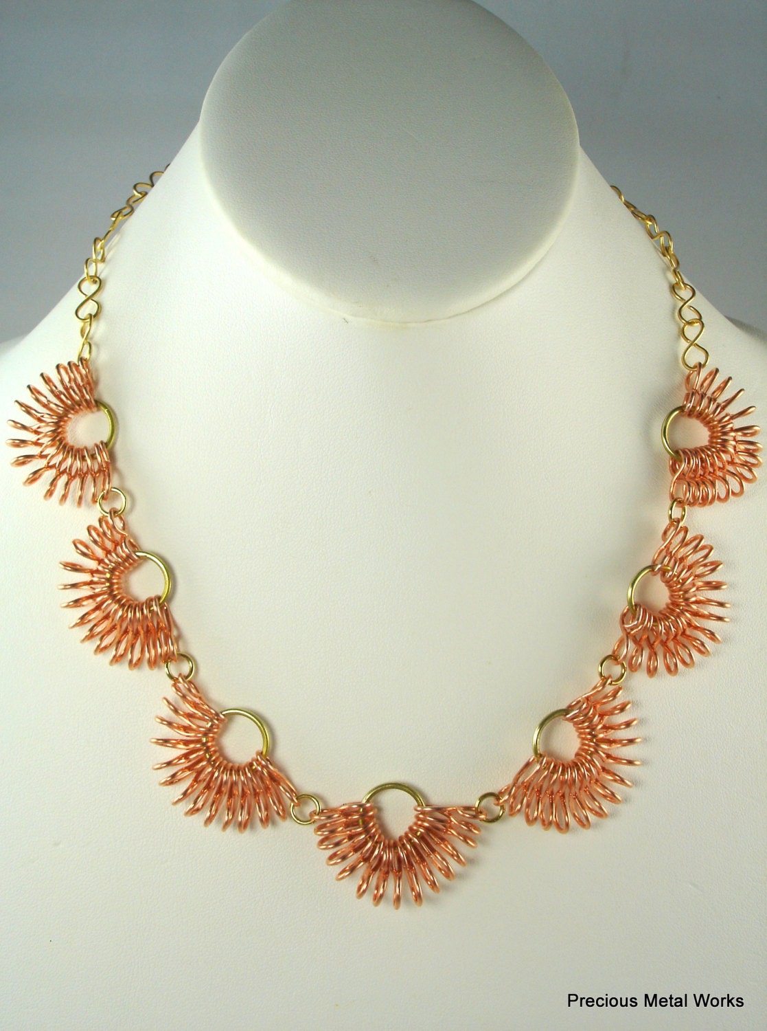 Infinite, handmade, copper and brass wire, seven, half floral motif stations, necklace